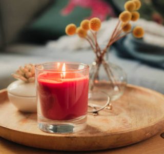 Scented candle burning on sofa table
Photo taken in natural light